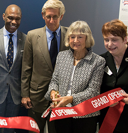 Joan Peirce cuts the ribbon for the new center.